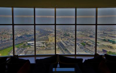 Scenic view of airport seen through window