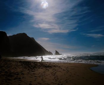 Scenic view of beach against sky