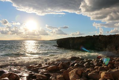 Scenic view of sea against sky at sunset