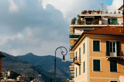 Buildings in city against sky