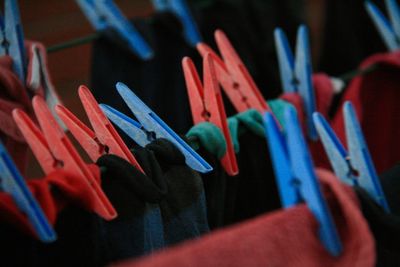Close-up of multi colored clothespins on clothesline