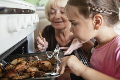 Mother and daughter in kitchen