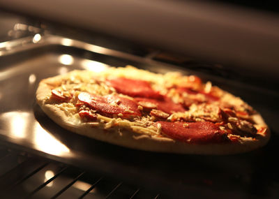 Close-up of meat in cooking pan