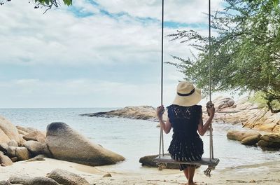 Rear view of woman on beach