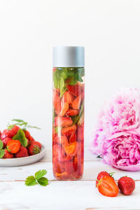 Close-up of fruits in glass jar on table