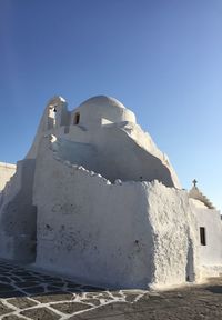 Low angle view of building against clear blue sky