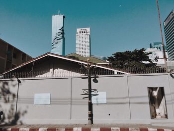 Low angle view of buildings against blue sky