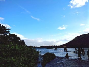 Scenic view of beach against blue sky