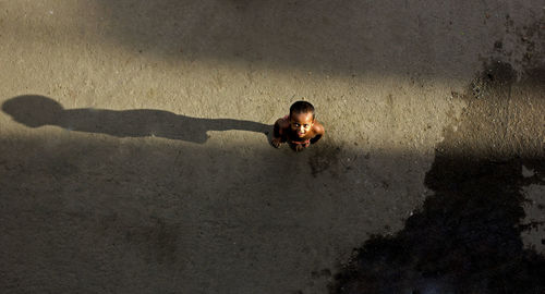 High angle view of man lying in water