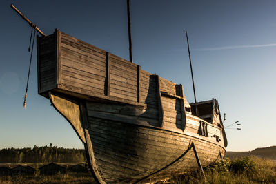 An old vikings boat staying on grass. russia, karelia. high quality photo