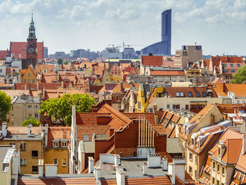 View from above on tiled rooftops of old medieval buildings of european polish city of wroclaw