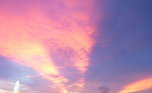 Low angle view of dramatic sky during sunset