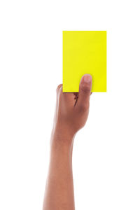 Midsection of person holding paper against white background