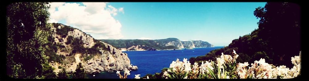 Scenic view of sea against cloudy sky