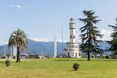 View of tower on field against sky