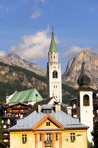 Church at cortina d ampezzo against sky