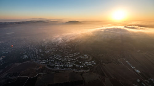 High angle view of cityscape against sky during sunset