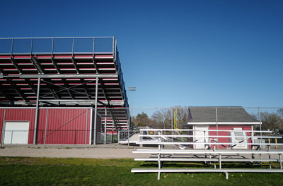 Closed and empty football field entrance against clear sky