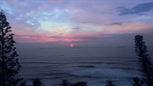 Scenic view of snow against sky at sunset