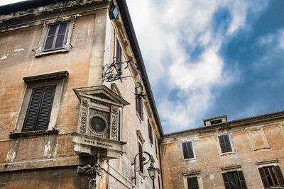 Low angle view of old building against sky