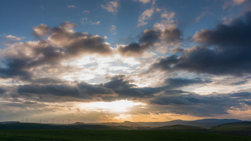 Scenic view of landscape against sky during sunset