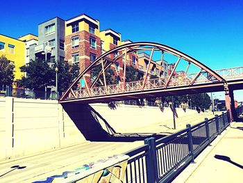 View of built structures against clear blue sky