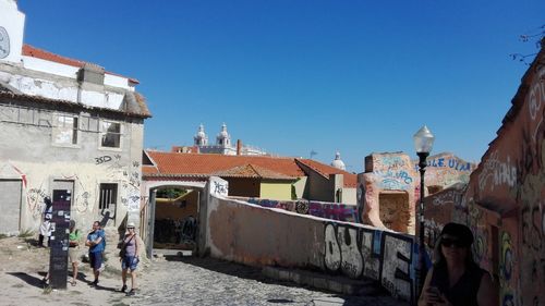 View of buildings against blue sky