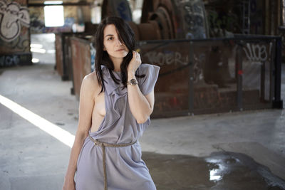 Portrait of beautiful woman in abandoned factory