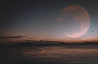 Scenic view of moon at sunset