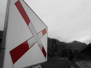 Low angle view of road sign against sky