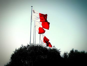 Low angle view of american flag against clear sky
