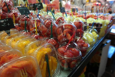 Strawberries in containers at market for sale