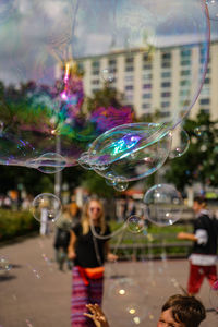 Close-up of people in bubbles