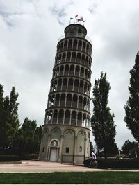 Low angle view of historical building against cloudy sky