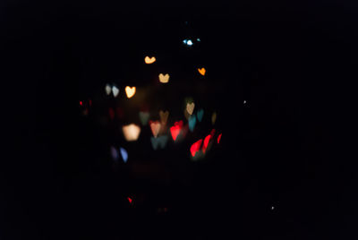 Close-up of illuminated lights in the dark
