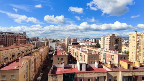 High angle view of buildings in city against sky