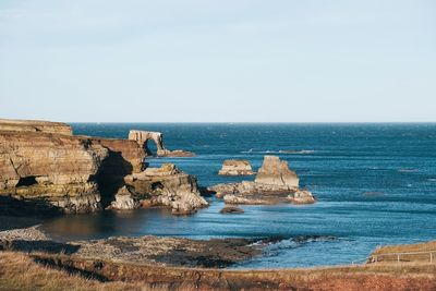 Scenic view of sea against clear sky