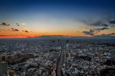 Aerial view of city at sunset