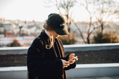 Young woman using mobile phone