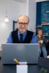 Man using laptop at office