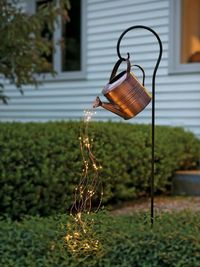 Close-up of illuminated lighting hanging at yard