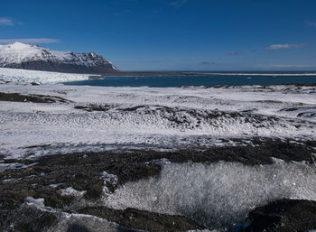 Scenic view of sea against sky during winter