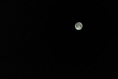 Low angle view of moon against sky at night