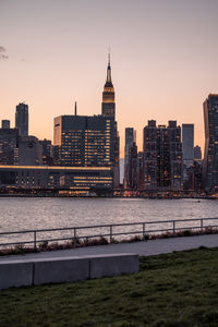 Buildings in city against clear sky