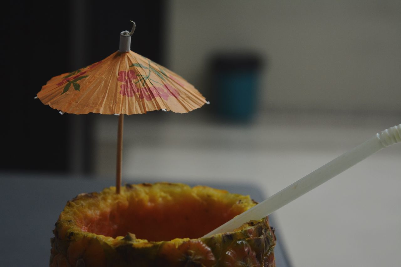 food, food and drink, freshness, indoors, close-up, fruit, still life, yellow, healthy eating, focus on foreground, slice, sweet food, indulgence, orange - fruit, table, ready-to-eat, selective focus, no people, plate