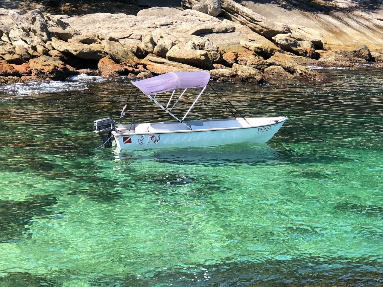 water, nautical vessel, waterfront, transportation, mode of transportation, moored, nature, day, sea, rock, solid, rock - object, no people, beauty in nature, tranquility, outdoors, reflection, beach, land, turquoise colored, shallow, fishing boat, rowboat