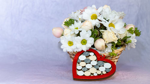 Close-up of white roses on table