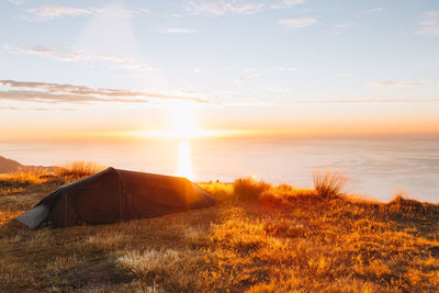 Scenic view of sunset over land