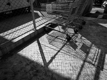 Shopping carts by fence