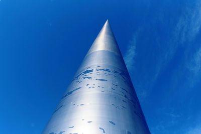 Low angle view of airplane against blue sky